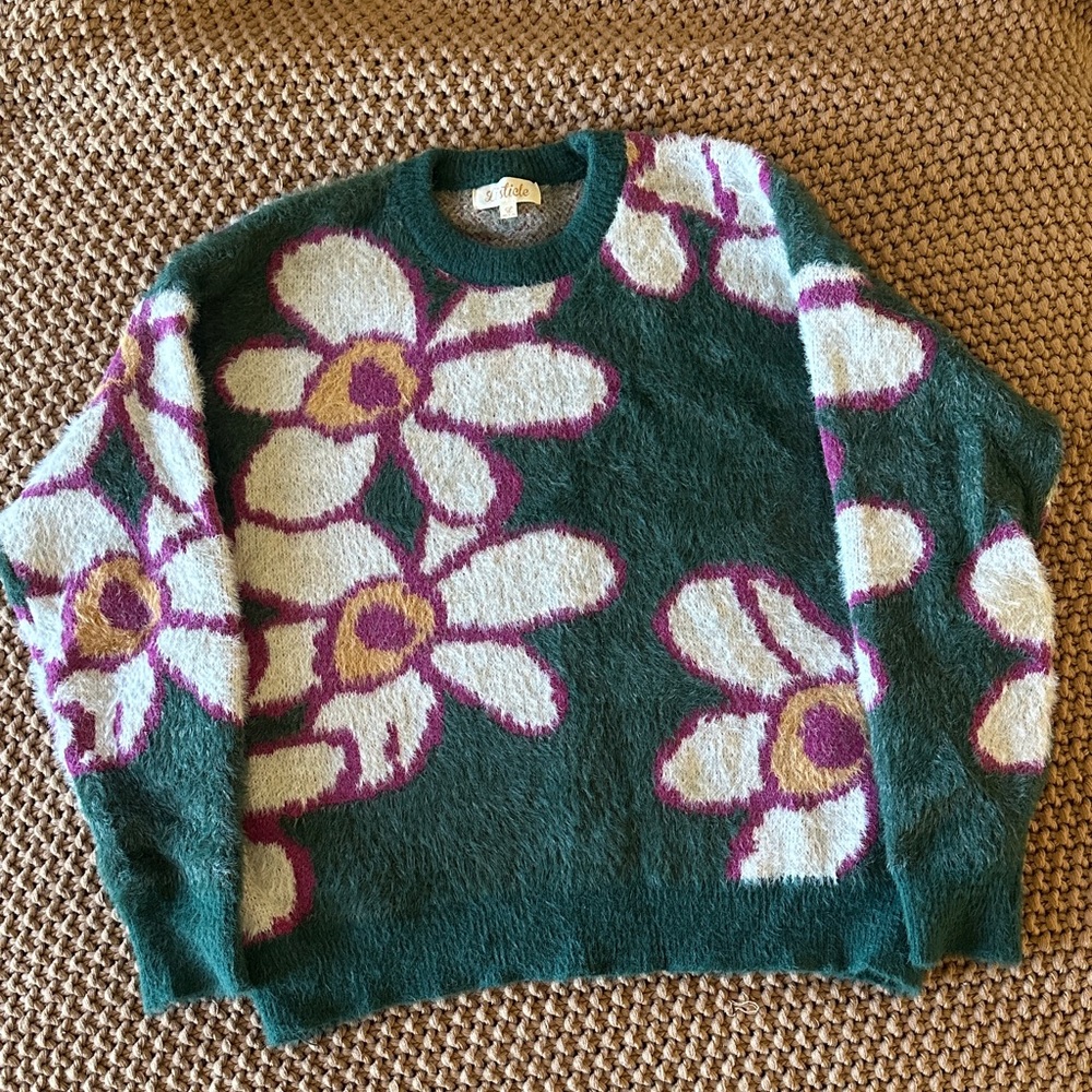 Fuzzy, floral women’s crewneck